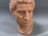 a clay head of a man on a table