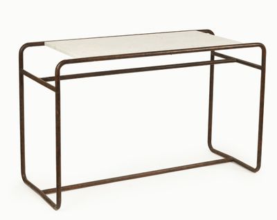 a white table with a metal frame and a glass top