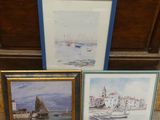 three framed pictures of boats and a boat in a harbor