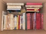 a box full of books that are sitting on a table
