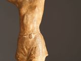 statue of a man with his arm raised in the air