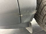 a close up of a car tire with a hole in it
