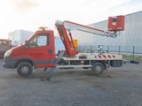 a red truck with a crane on the back of it