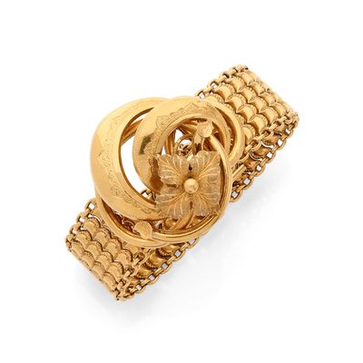une image représentant une bague en or surmontée d'une fleur