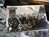many old photos of a group of men posing for a picture
