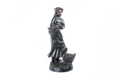 statue of a woman with a basket of flowers on her head
