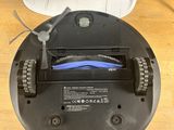 an image of a robotic vacuum cleaner on a desk