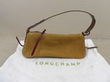 Sac à main Longchamp en cuir moutarde avec une bandoulière en cuir marron