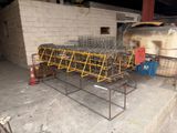 many cages that are sitting on the ground