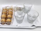 a tray with glasses and a bottle of wine on it