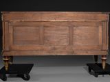 pair of antique wooden beds on castors with black bases