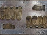 a metal plate that has a bunch of metal items on it