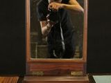a man taking a picture of himself in a mirror