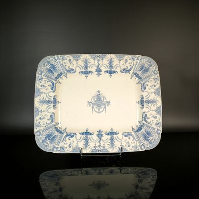 a blue and white plate with a horse on it