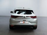 the rear end of a silver car in a white room