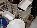 many plates and pans sitting on a pallet