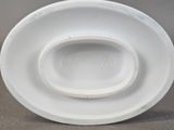 a close up of a white plate on a table