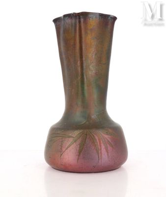 a vase that is sitting on a white surface