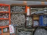 many different types of screws and nuts in a box