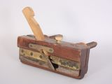a small wooden tool box with a knife in it