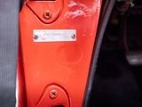 a close up of a car door handle with a metal plate