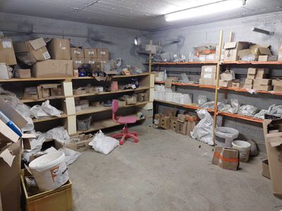 a room with a lot of boxes and boxes on the shelves