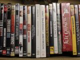 a lot of dvds in a box on the shelf