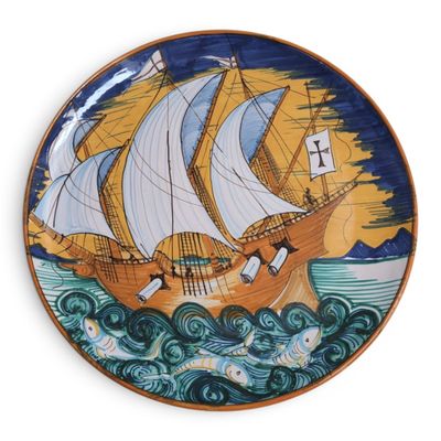 a plate with a painting of a ship on it