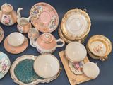 many different types of tea and coffee cups and saucers