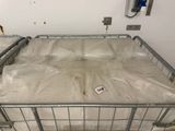 a metal bed with a mattress on it in a room