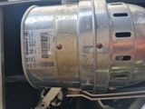 a close up of a metal tank on the back of a truck