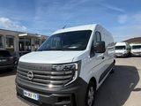the white van is parked in a parking lot with other vehicles