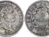 a close up of a coin on a white surface