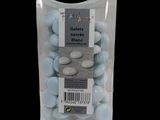 a bag of blue and white candies on a black background