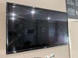 a flat screen tv mounted on the wall in a room