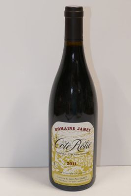 a bottle of wine that is sitting on a table