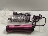 a hair dryer and a blow dryer sitting on a table