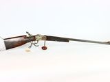 an old gun with a wooden barrel and a metal handle