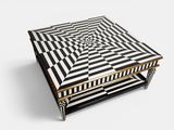 a black and white table with a geometric design on top