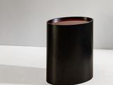 an image of a black vase sitting on a white surface