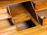 a wooden desk with drawers and drawers on top of it