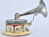 an old fashioned gramphone with a clock on top of it
