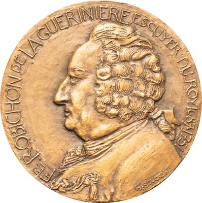 une image représentant une médaille d'or sur laquelle figure le visage d'un homme