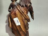 a statue of a woman with a child on her back