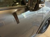 a close up of a car ' s side mirror with a sticker on it