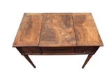 a wooden table with two drawers and a drawer underneath it