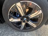 a close up of a tire on a black car