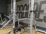 a row of exercise equipment in a gym room