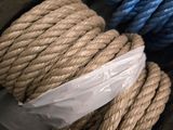 a pile of rope in a basket on the floor