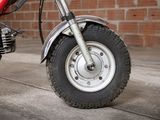 a close up of a motorcycle with a tire on the ground